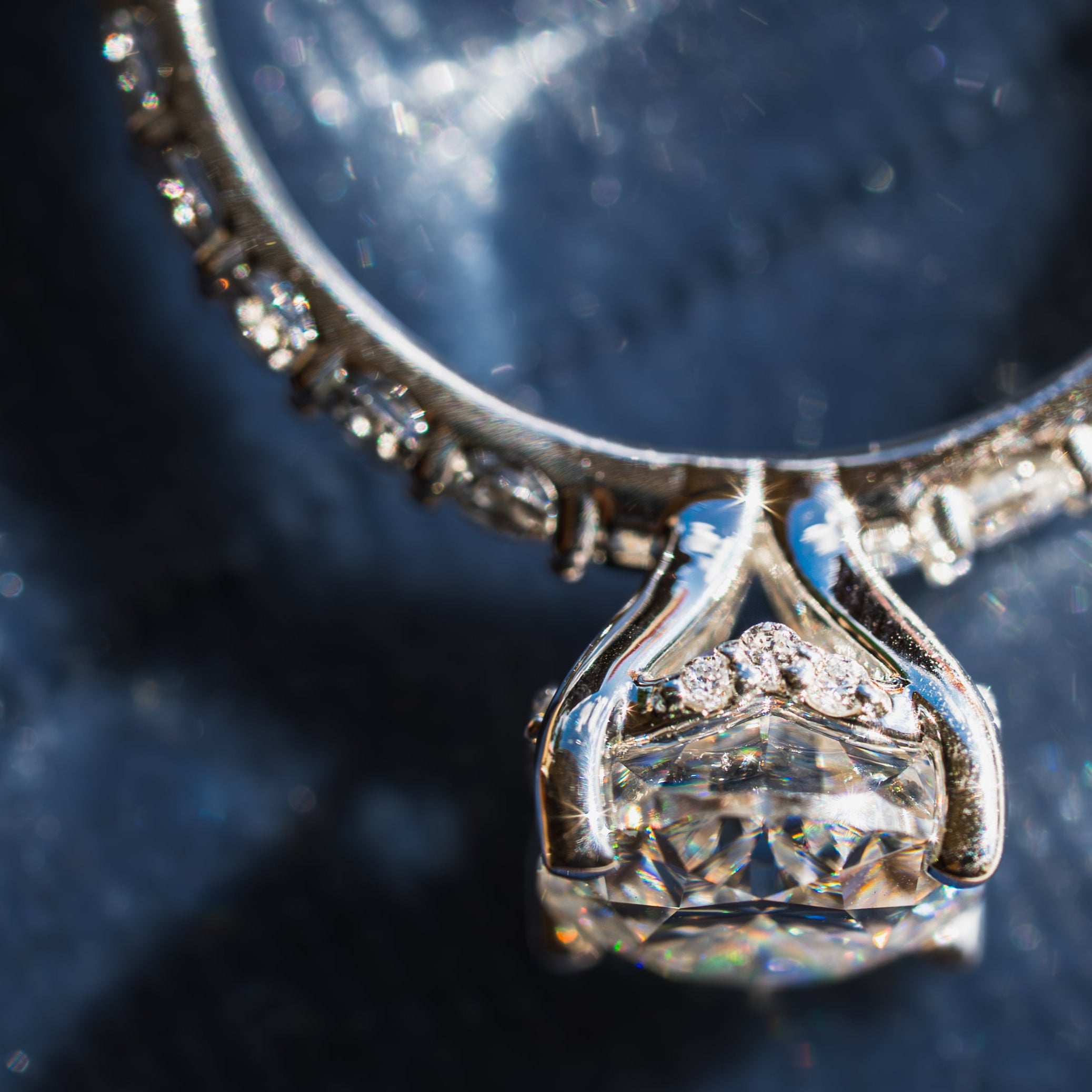 Close-up of a diamond ring with a blue background