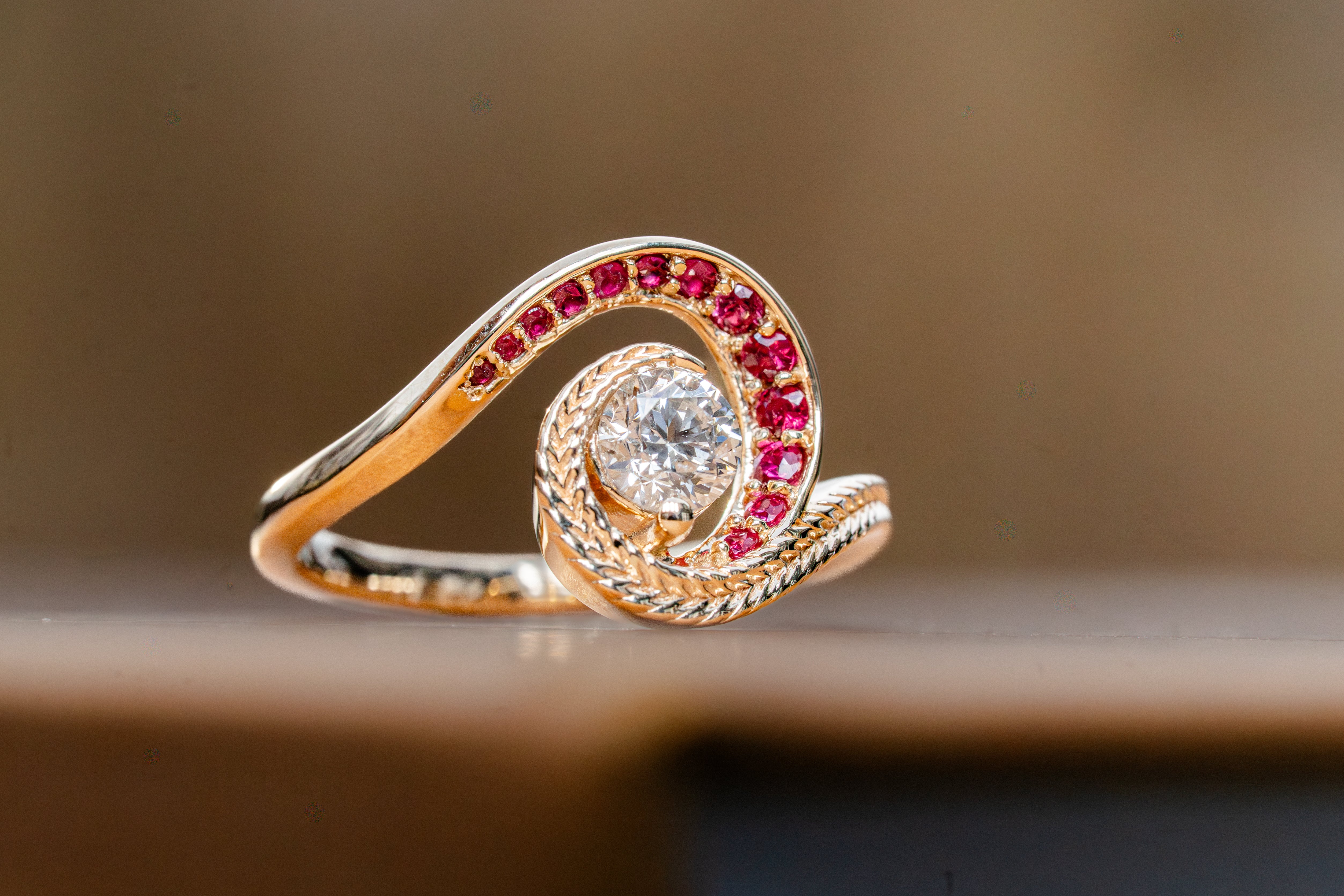 Custom Swirling Diamond Ruby Wave Ring with Maile Vine